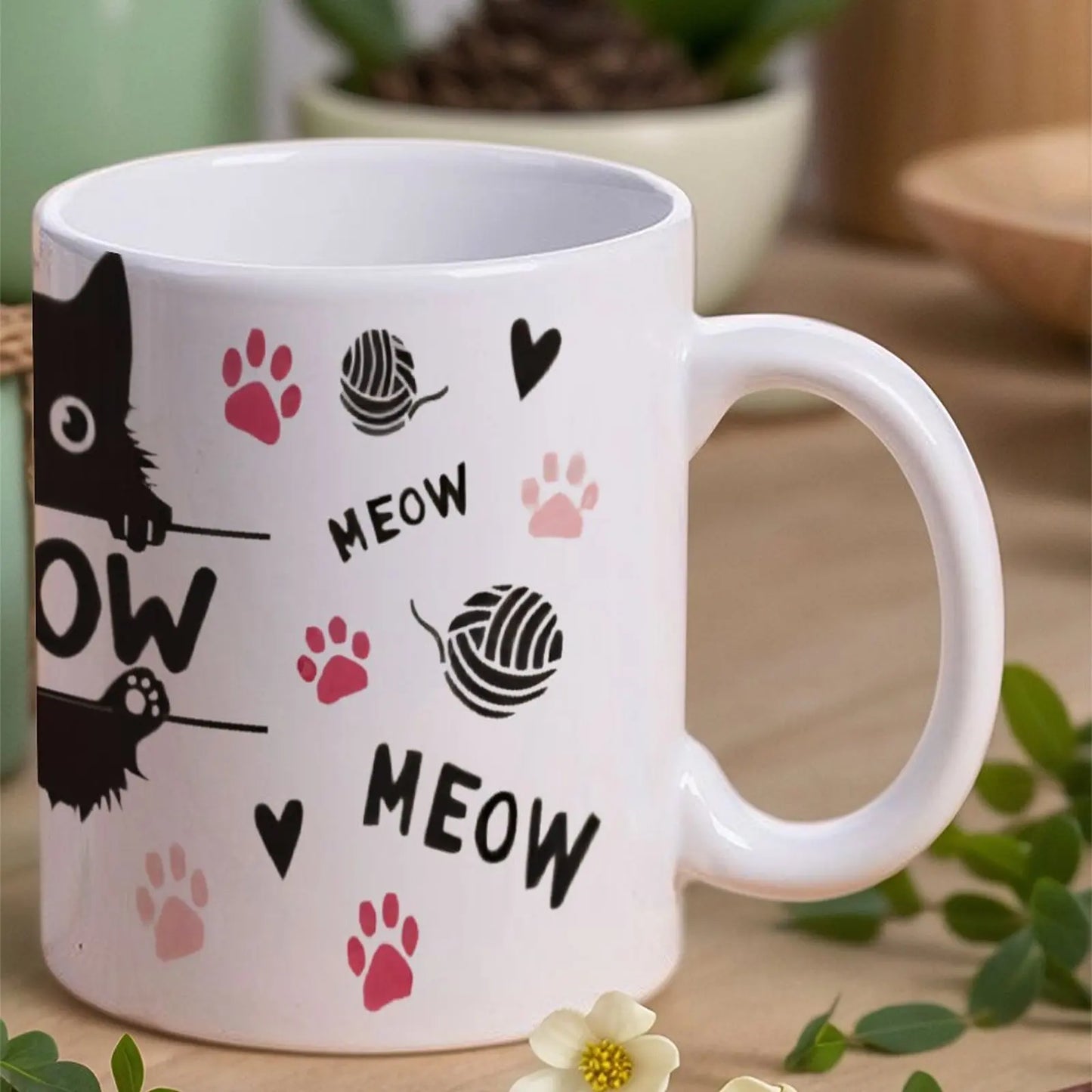 Black Cat Sitting On Top Of A Bar With Paw Prints And The Word Meow Cup